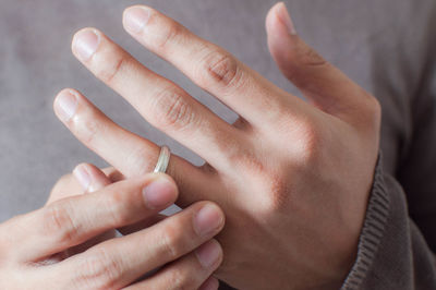 Close-up of couple holding hands