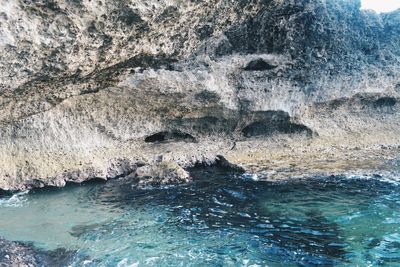 Aerial view of rock formation in sea