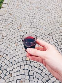 High angle view of woman holding drink