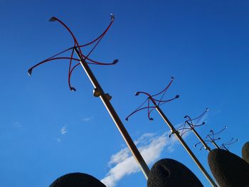 Low angle view of bare tree against blue sky