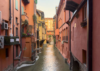 Canal amidst buildings in city