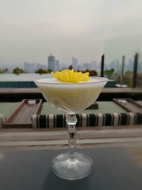 Close-up of white wine in glass on table