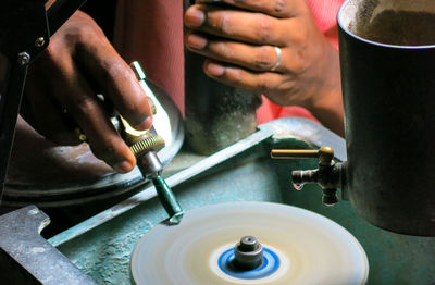 Midsection of man working in workshop