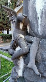 Statue amidst plants in park