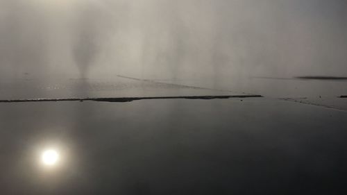 Close-up of wet surface against sky during rainy season