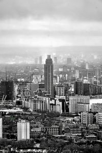 High angle view of modern buildings in city against sky