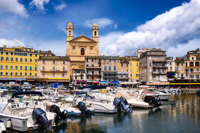 Vieuw on église saint jean-baptiste in bastia from the vieux port with  boats resting in the habour