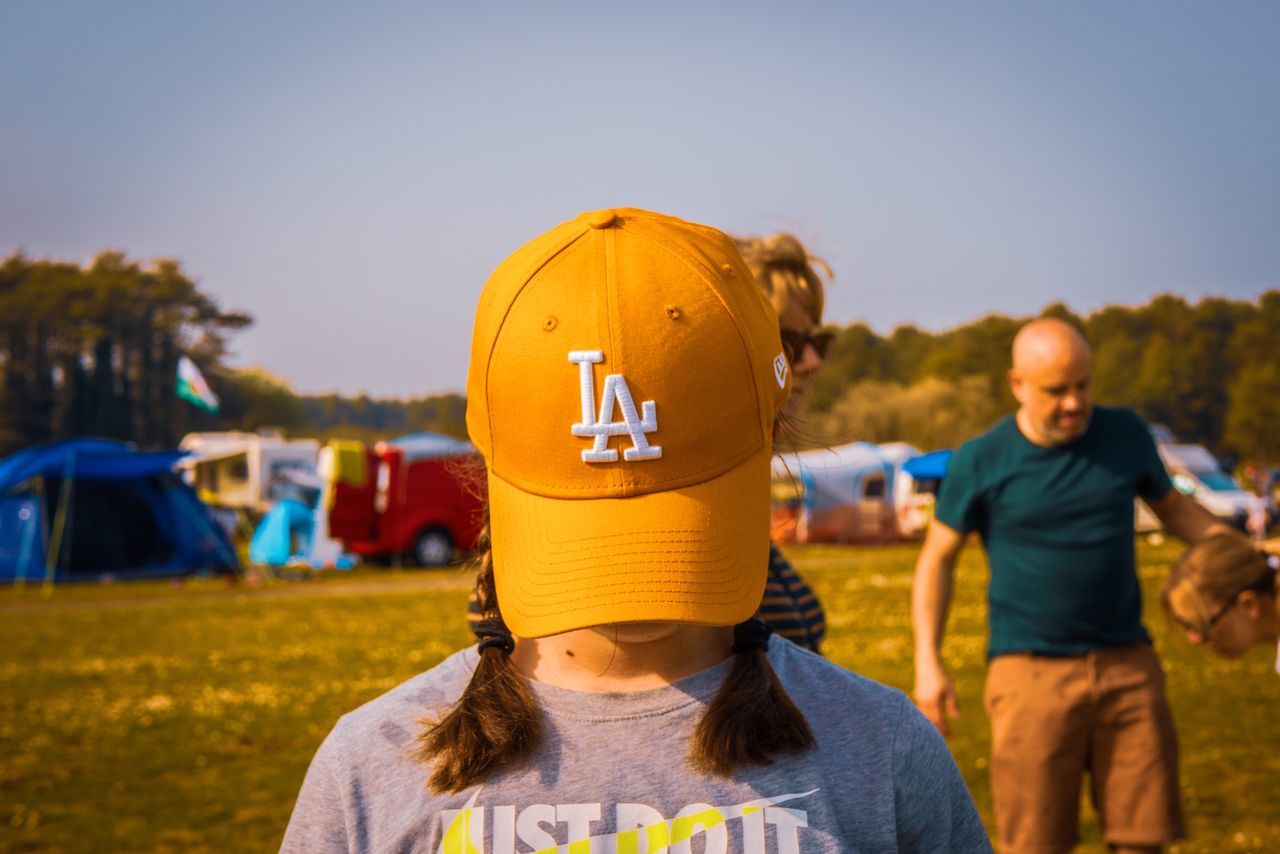 child, real people, childhood, men, focus on foreground, lifestyles, leisure activity, front view, women, nature, casual clothing, incidental people, field, females, males, two people, sky, land, girls, outdoors