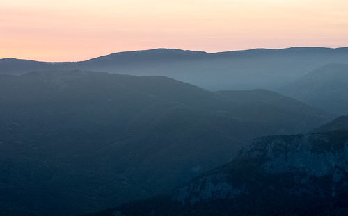 Scenic view of mountains against sky during sunset