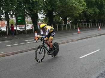 Man riding bicycle on road