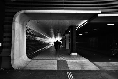 Man in illuminated tunnel