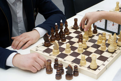 Low angle view of men playing on table