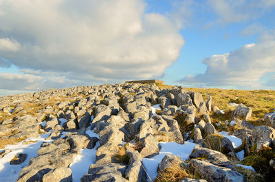 Panoramic view of rock formations against sky