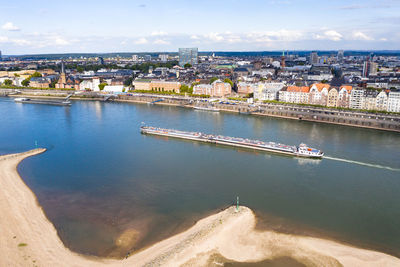 High angle view of bridge over river by buildings in city