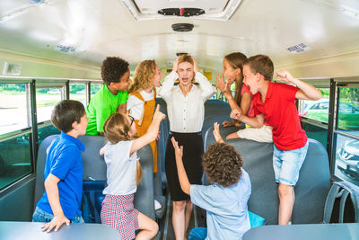 Rear view of people sitting in bus