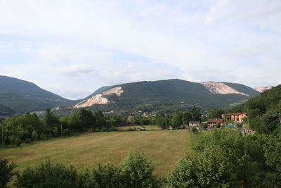 Scenic view of landscape and mountains against sky