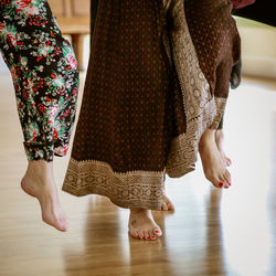 Low section of women standing on floor