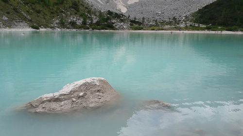 Scenic view of lake by rocks