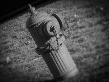 Close-up of old electric lamp on field