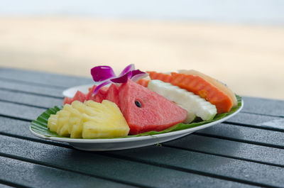 Close-up of fruits in plate on table