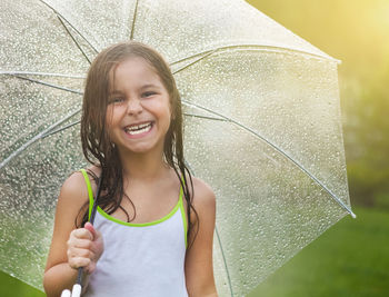 Portrait of smiling young woman standing outdoors