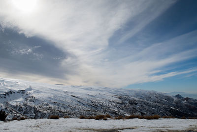 Scenic view of snow covered mountain against sky