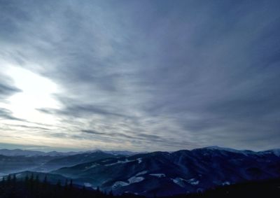 Scenic view of mountains against sky during winter