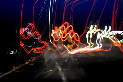 Close-up of light painting against black background