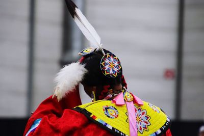 Rear view of person wearing costume in city