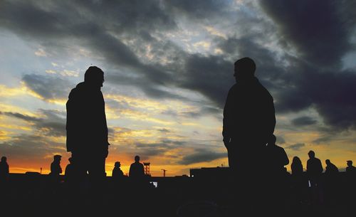 Silhouette of statue against cloudy sky