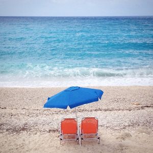 Lounge chairs and parasol at beach