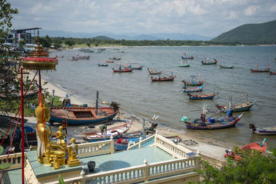 Boats moored at harbor