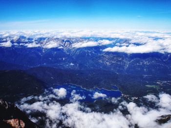 Scenic view of mountains against blue sky