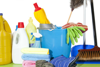 Cleaning equipment on table against white background