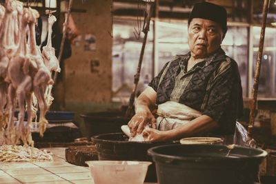 Man working at market stall