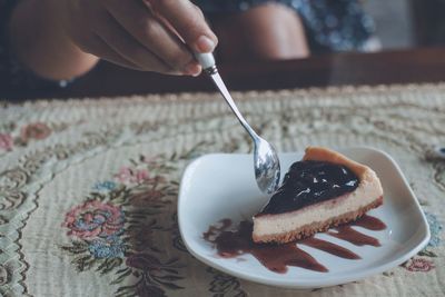 Close-up of hand holding ice cream cone