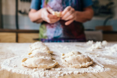 Midsection of man preparing food at home