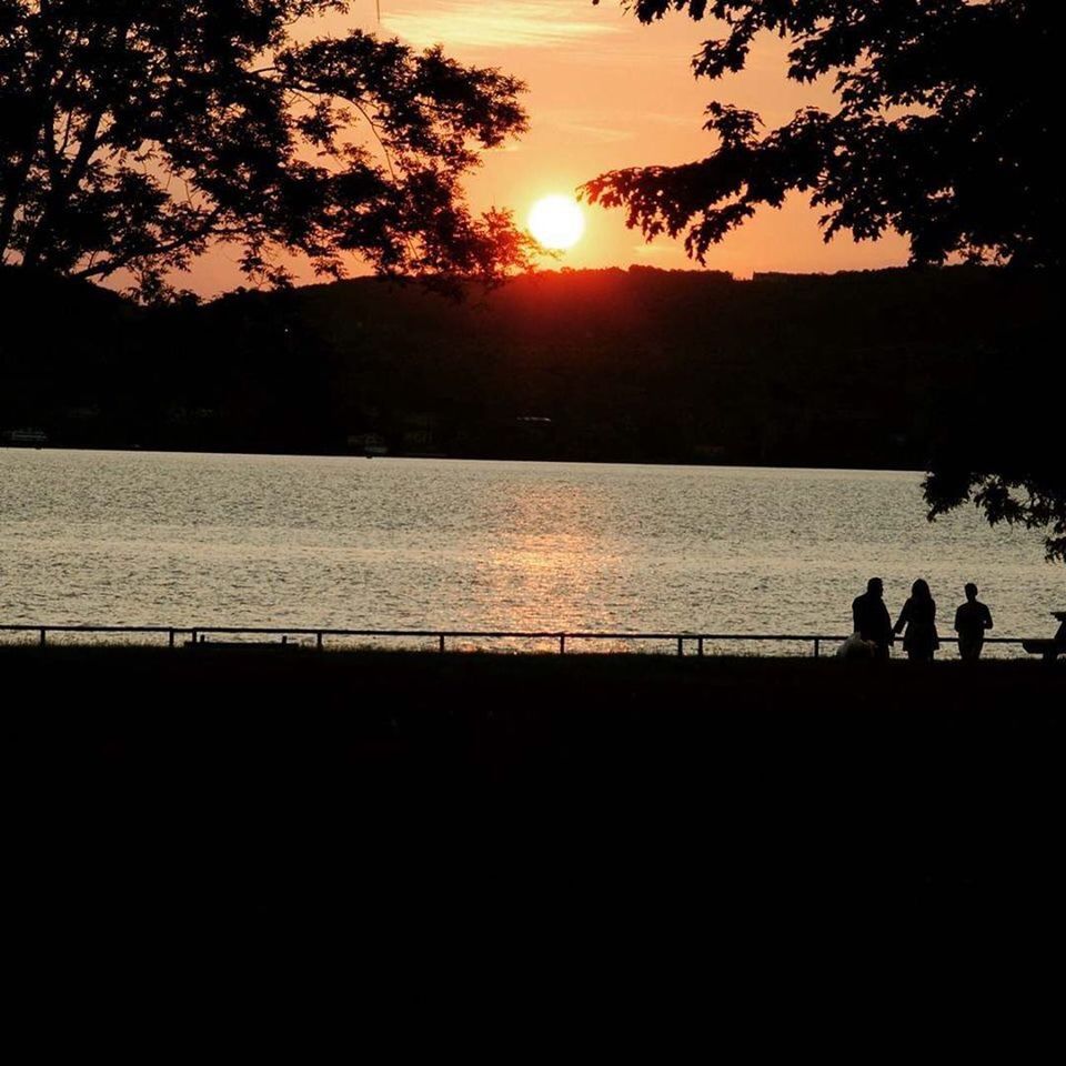 SILHOUETTE PEOPLE ON BEACH DURING SUNSET