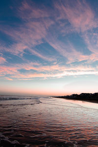 Scenic view of sea against sky at sunset