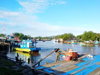 Boats moored at harbor