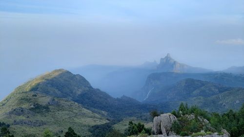 Beautiful scenic view from kodanad view point ooty of misty rain cloud hill mountain green forest