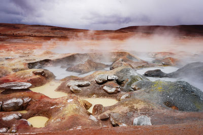 Aerial view of volcanic landscape against sky