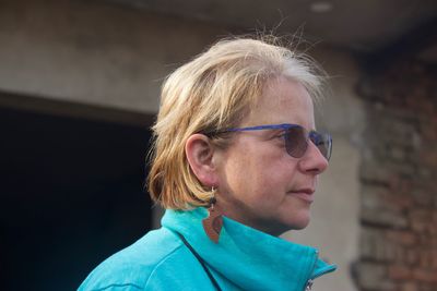 Portrait of mature woman looking away outdoors