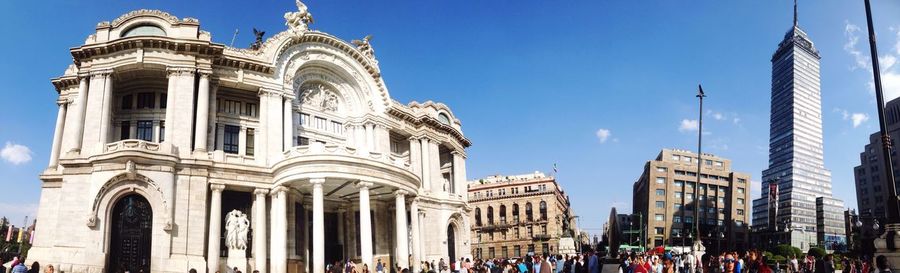 Low angle view of historic buildings against blue sky