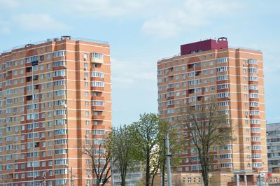 Low angle view of skyscrapers against sky