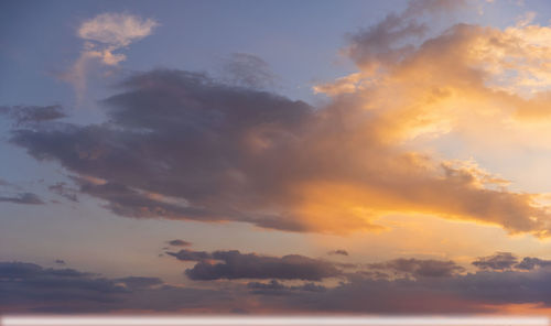 Low angle view of dramatic sky during sunset