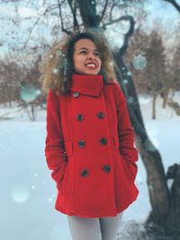 Portrait of woman standing in snow