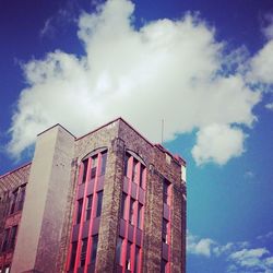 Low angle view of building against blue sky