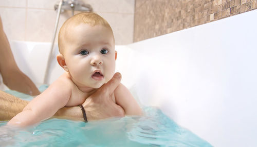 Cute baby girl taking bath
