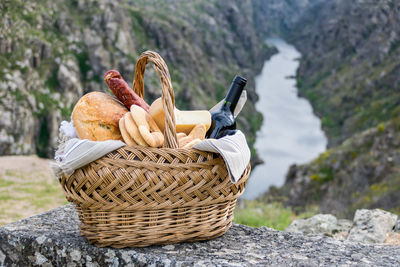 Close-up of picnic basket on mountain